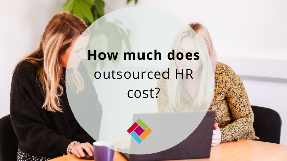 How much does outsourced HR cost Two females at a desk looking at a laptop.