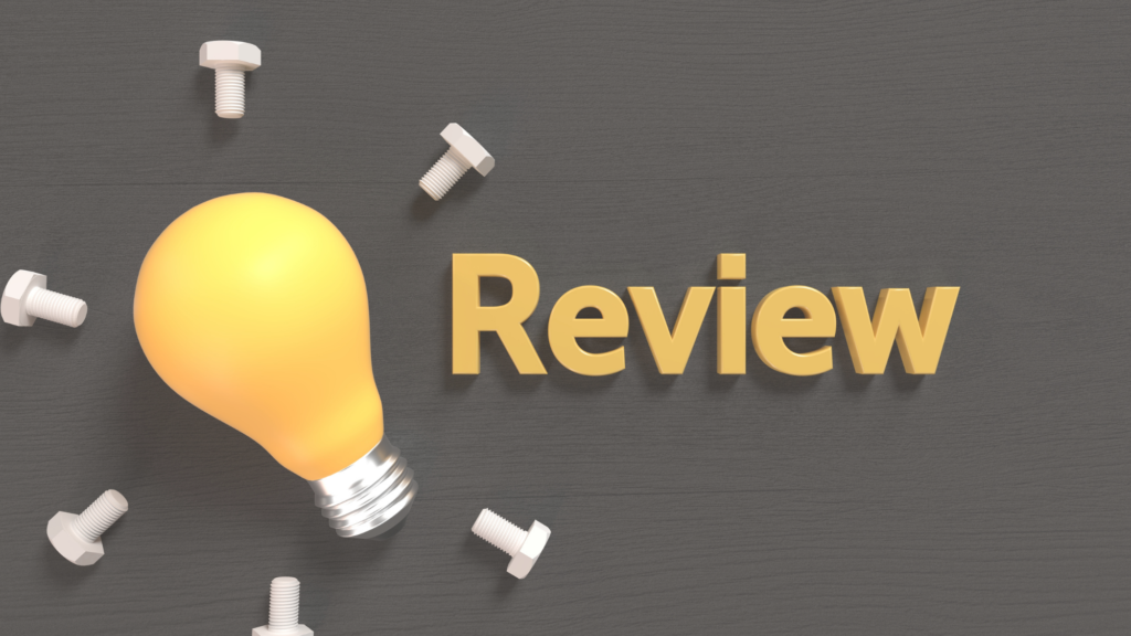 Probationary periods: a yellow light bulb beside the word “Review” in yellow letters on a dark grey surface, with white bolts scattered around